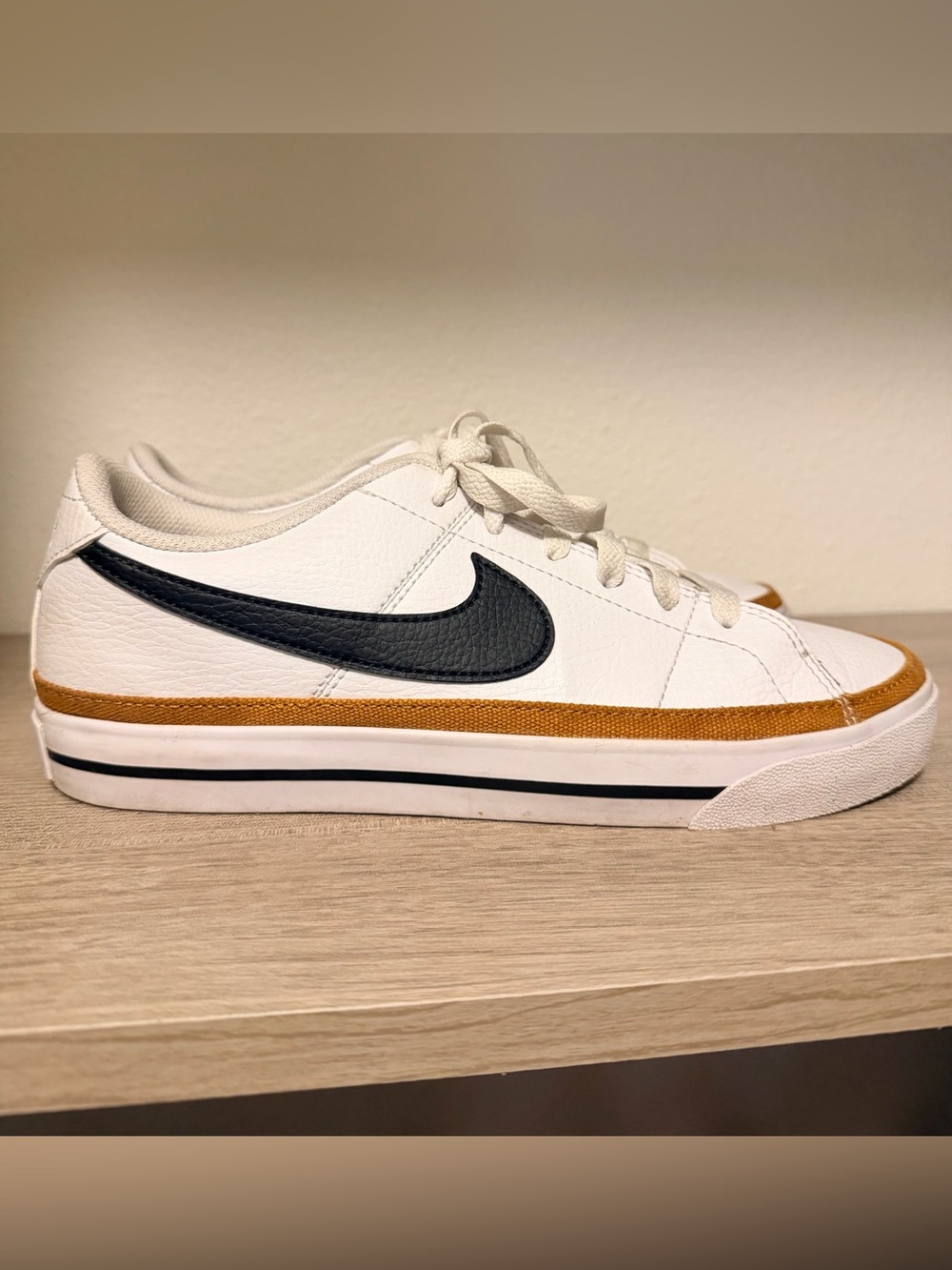 Nike Women’s White Leather Sneakers with Black Swoosh and Tan Trim